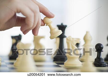 Stock Image - Playing game of chess. Fotosearch