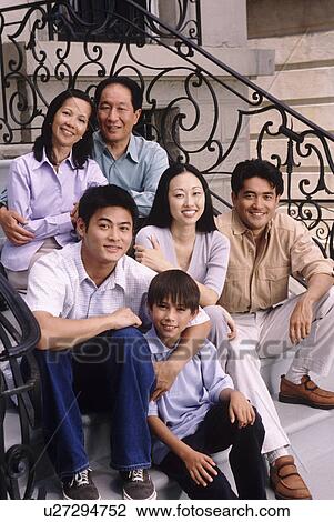 Portrait of a family on the front steps of their house View Large Photo Image Stock Image - Portrait of a family on the front steps of their house. Fotosearch