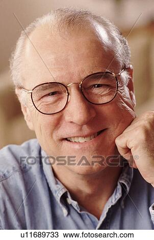 Stock Image - Portrait of a man wearing glasses. Fotosearch