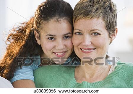Stock Photograph - Portrait of a mother and daughter. Fotosearch