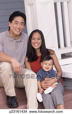 Portrait of a young family View Large Photo Image Picture - Portrait of a young family. Fotosearch
