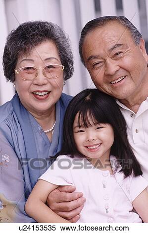 Portrait of grandparents with their granddaughter View Large Photo Image Stock Photography - Portrait of grandparents with their granddaughter. Fotosearch