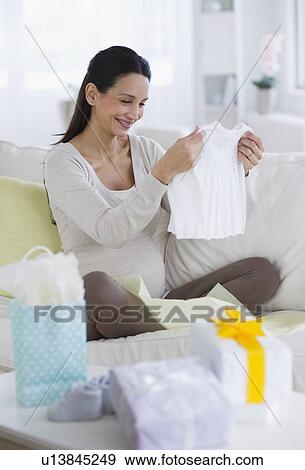 Stock Photo - Pregnant woman at baby shower. Fotosearch