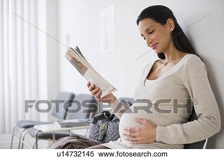 Pregnant woman in waiting room View Large Photo Image Stock Photography - Pregnant woman in waiting room. Fotosearch