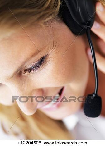 Stock Photo - Receptionist wearing headset. Fotosearch