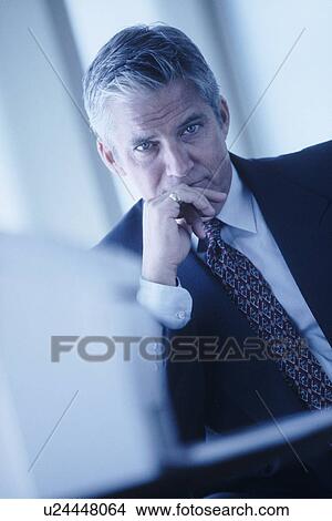 Picture - Serious businessman. Fotosearch