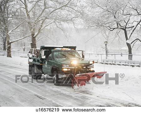 Stock Photo - Snow plow truck clearing road. Fotosearch
