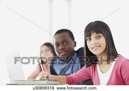 Stock Photo - Students in classroom. Fotosearch