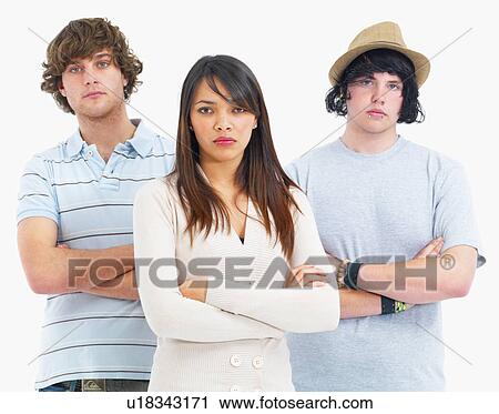 Stock Image - Three people with their arms crossed. Fotosearch