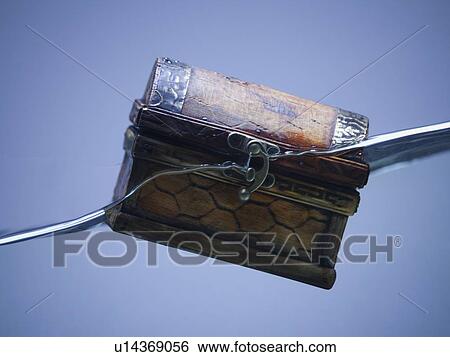Stock Photograph - Treasure chest sinking in water. Fotosearch