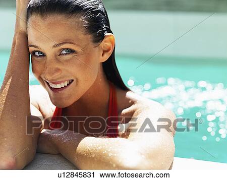 Woman at side of pool View Large Photo Image Stock Image - Woman at side of pool. Fotosearch
