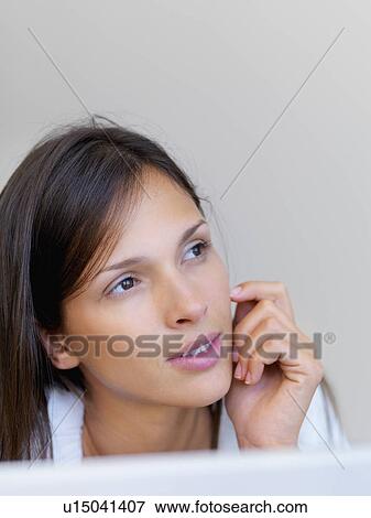 Stock Photo - Woman daydreaming. Fotosearch