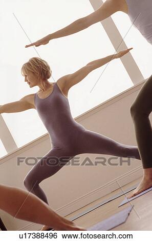 Stock Photograph - Woman doing a yoga pose. Fotosearch