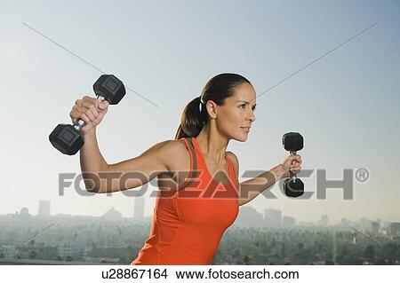 Woman doing weight training View Large Photo Image Picture - Woman doing weight training. Fotosearch