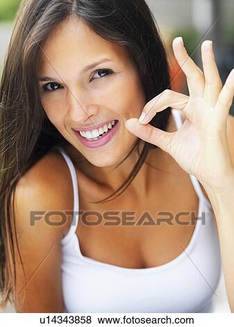 Woman giving okay sign View Large Photo Image Stock Photo - Woman giving okay sign. Fotosearch