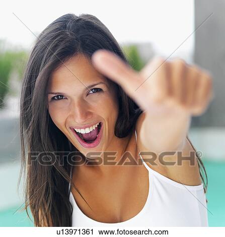 Stock Image - Woman giving thumbs up. Fotosearch