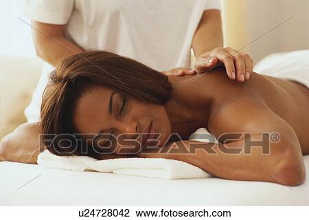 Stock Image - Woman having a massage. Fotosearch
