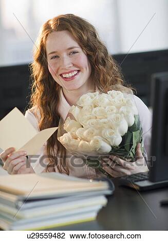 Woman holding bouquet of flowers View Large Photo Image Stock Image - Woman holding bouquet of flowers. Fotosearch