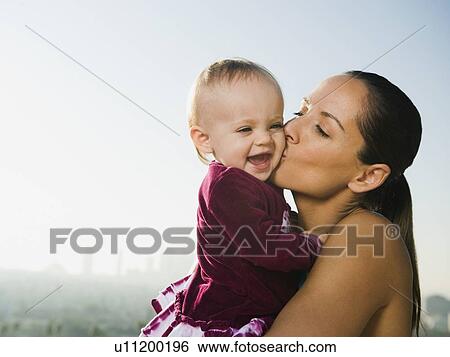Woman kissing toddler View Large Photo Image Stock Photograph - Woman kissing toddler. Fotosearch