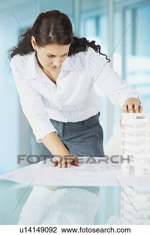 Woman looking at architectural model View Large Photo Image Stock Image - Woman looking at architectural model. Fotosearch