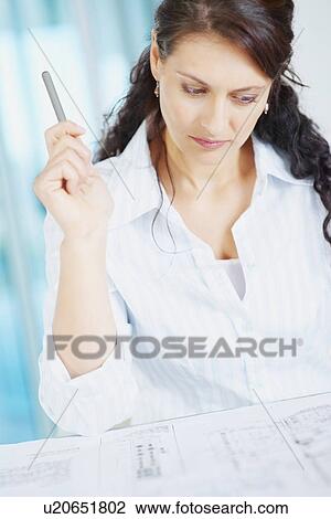 Woman looking at blueprints View Large Photo Image Stock Image - Woman looking at blueprints. Fotosearch