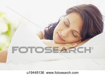 Woman napping View Large Photo Image Stock Photograph - Woman napping. Fotosearch
