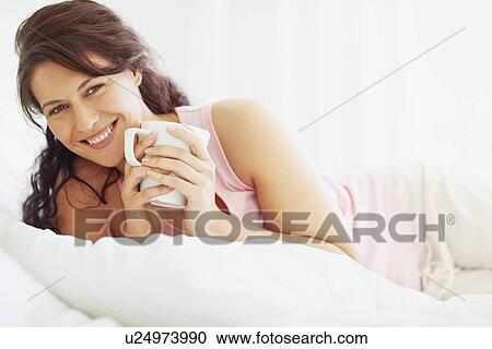 Woman relaxing with a coffee View Large Photo Image Stock Image - Woman relaxing with a coffee. Fotosearch