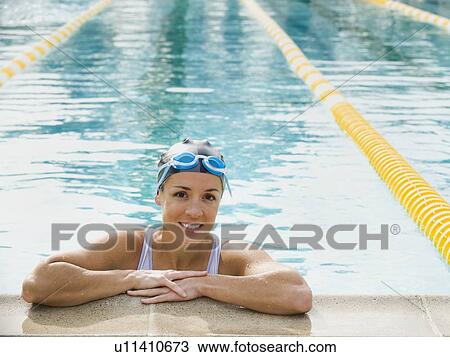 Woman resting after swimming laps View Large Photo Image Stock Image - Woman resting after swimming laps. Fotosearch