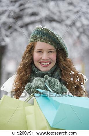 Woman shopping on a winter day View Large Photo Image Stock Image - Woman shopping on a winter day. Fotosearch