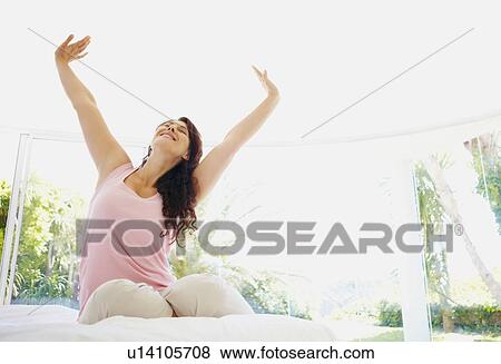 Stock Photo - Woman stretching in the morning. Fotosearch