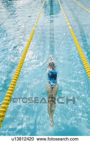 Stock Image - Woman swimming laps. Fotosearch