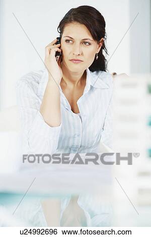 Woman talking on cellular phone View Large Photo Image Stock Photograph - Woman talking on cellular phone. Fotosearch