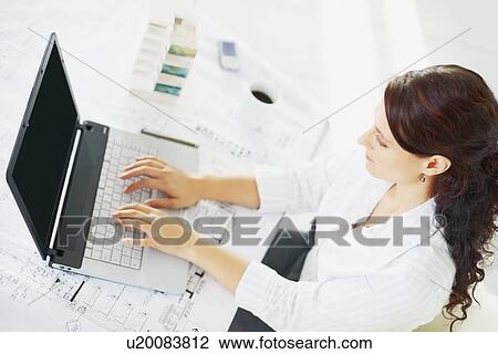 Woman typing on laptop View Large Photo Image Stock Image - Woman typing on laptop. Fotosearch
