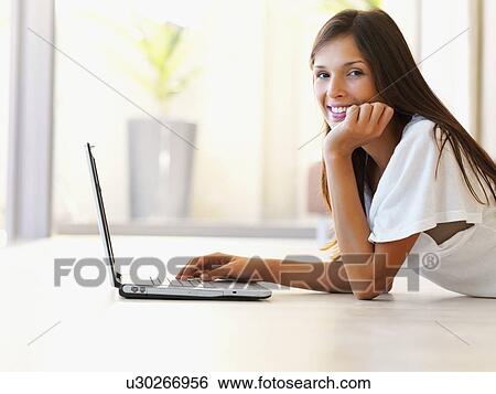 Woman typing on laptop View Large Photo Image Stock Photograph - Woman typing on laptop. Fotosearch