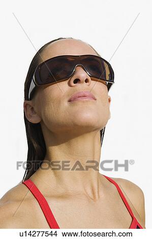 Picture - Woman wearing sunglasses. Fotosearch
