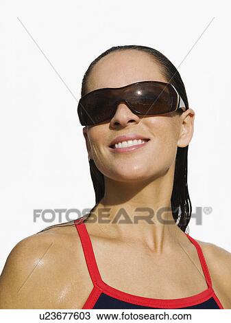 Woman wearing sunglasses View Large Photo Image Stock Image - Woman wearing sunglasses. Fotosearch