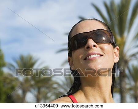 Woman wearing sunglasses View Large Photo Image Stock Photo - Woman wearing sunglasses. Fotosearch