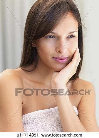 Stock Image - Woman wearing towel. Fotosearch