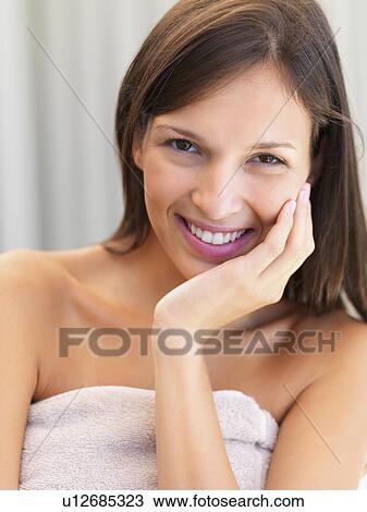 Stock Image - Woman wearing towel. Fotosearch