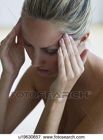 Stock Photo - Woman with headache. Fotosearch