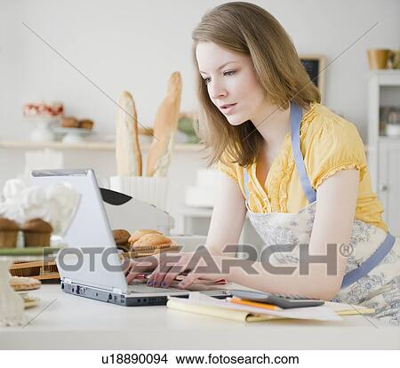 Picture - Woman working in bakery. Fotosearch