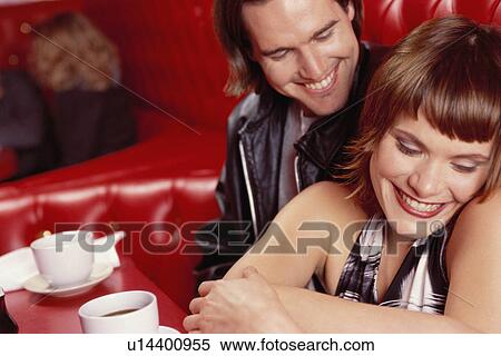 Stock Photography - Young couple in a restaurant. Fotosearch