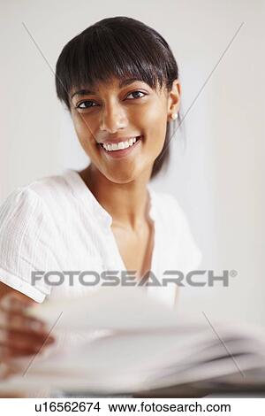 Picture - Young girl doing homework. Fotosearch