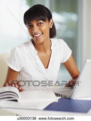 Young girl doing homework View Large Photo Image Stock Photo - Young girl doing homework. Fotosearch