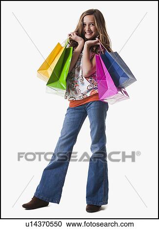Young girl holding shopping bags View Large Photo Image Stock Image - Young girl holding shopping bags. Fotosearch
