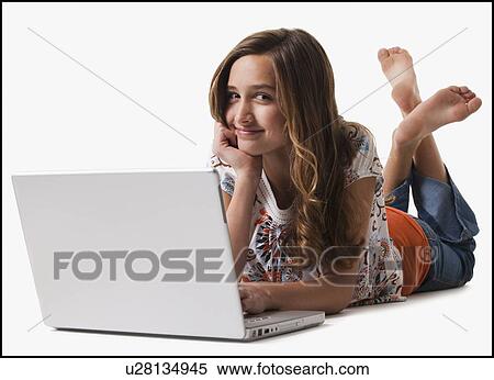 Stock Photography - Young girl using laptop. Fotosearch