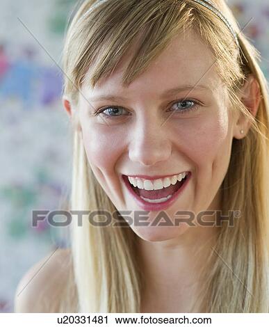 Young woman laughing View Large Photo Image Stock Image - Young woman laughing. Fotosearch