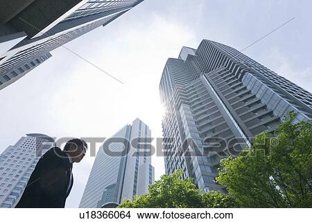 A businessman in business district View Large Photo Image Picture - A businessman in business district. Fotosearch