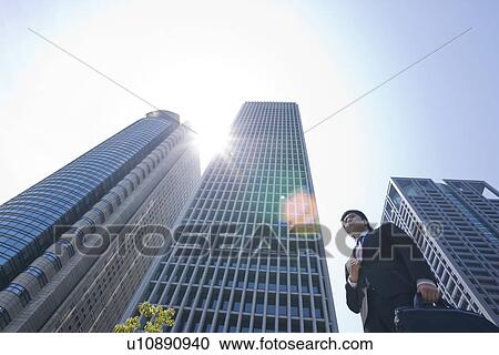 A businessman in business district View Large Photo Image Stock Image - A businessman in business district. Fotosearch