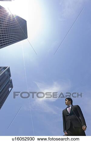 A businessman in business district View Large Photo Image Stock Image - A businessman in business district. Fotosearch